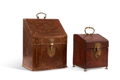 Two brown morocco letter and cutlery cases...