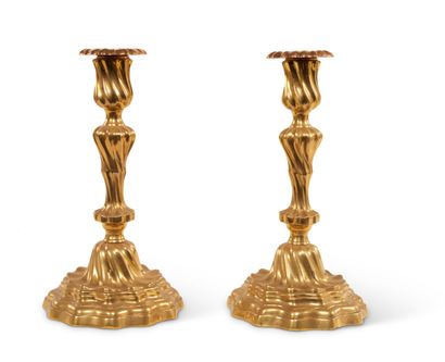 Pair of gilt brass candlesticks, the baluster...