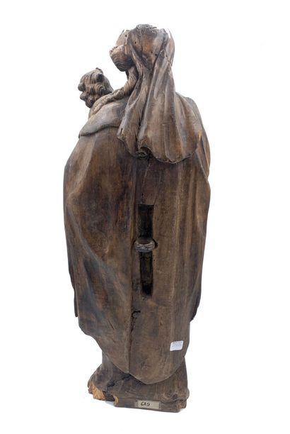 Groupe en bois sculpté figurant une Vierge...
