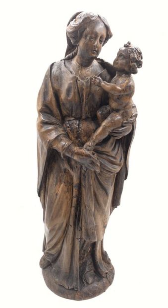 Groupe en bois sculpté figurant une Vierge...
