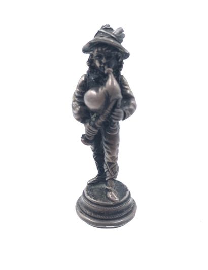 Cachet en argent figurant un musicien de...