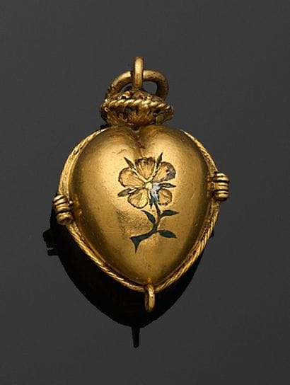PENDENTIF en forme de cœur en or, ouvrant,...