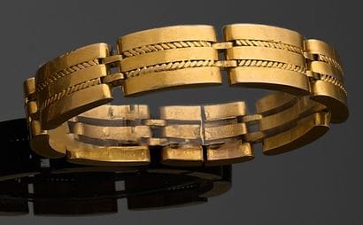 BRACELET articulé en or jaune 750 millièmes,...