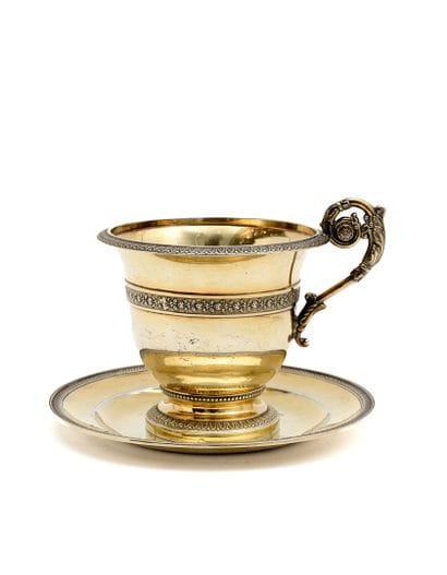 A vermeil chocolate cup and saucer, Empire...