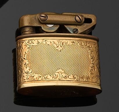 BRIQUET in gilt metal and 585 thousandths...