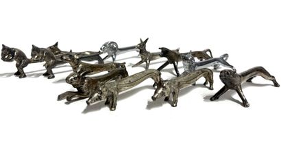 TWELVE silver-plated animal hat-holders,...