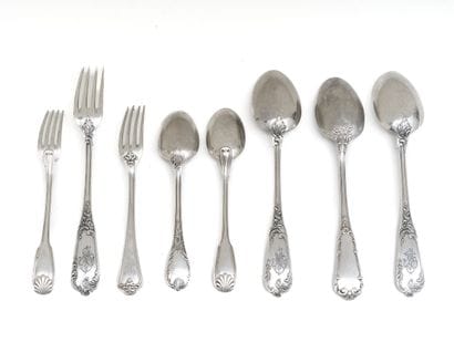 SET of four spoons and three forks in silver...