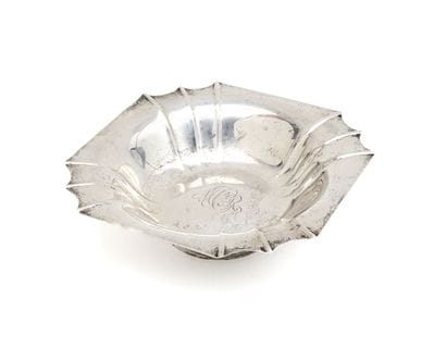 800-millil silver fruit CUP, resting on a...