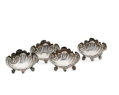 SET of four saltcellars with rocailles decoration...
