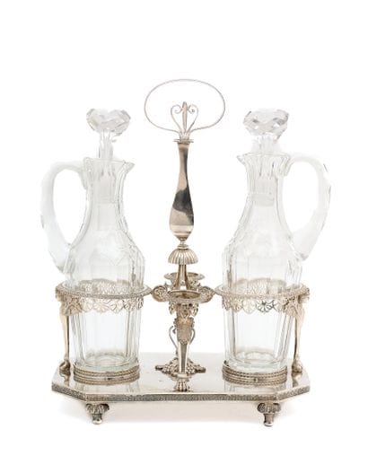SILVER HOLDER, resting on four feet, the...