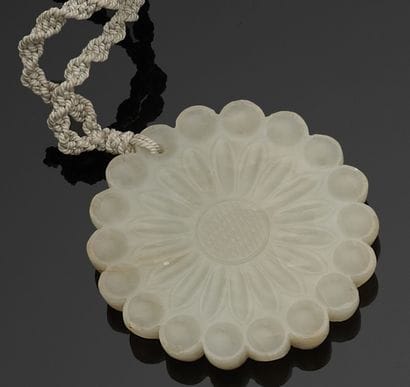 Twisted cord necklace with jade flower pendant.
Pendant...