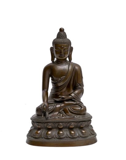 BUDDHA in bronze with brown patina on a lotiform...