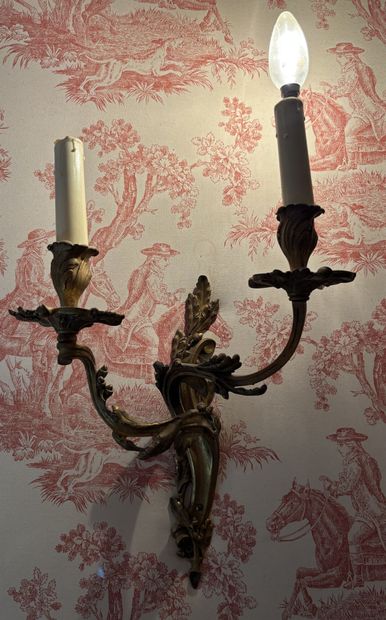 Pair of gilded bronze wall lights with two...