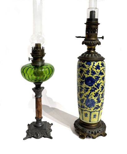 REUNION OF TWO PETROLEUM LAMPS, one a porcelain...
