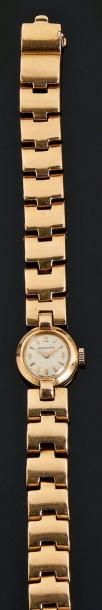 Montre bracelet de dame, ronde, en or jaune,...