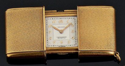 Montre de poche en or jaune guilloché à système...