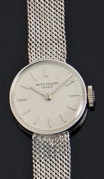 Montre bracelet de dame, ronde, en or gris,...
