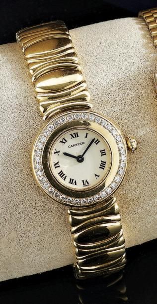 CARTIER
Montre bracelet de dame en or jaune...