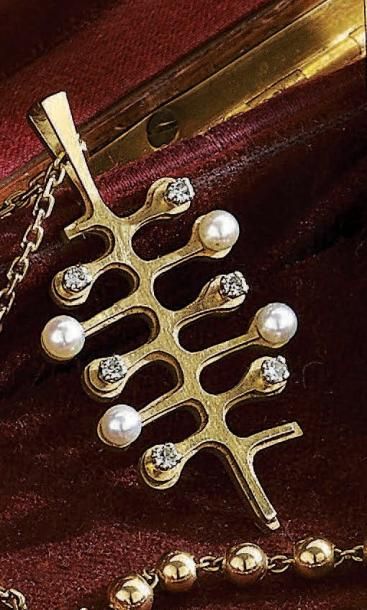 COLLIER articulé en or jaune 18 k, retenant...