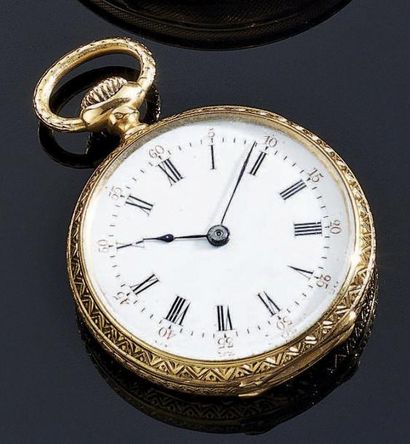 MONTRE de dame en or jaune 18 k gravé, le...