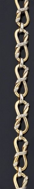 BRACELET articulé en or jaune 18 k 750°/oo,...