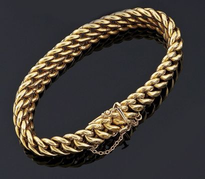 BRACELET articulé en or jaune 18 k 750°/oo,...