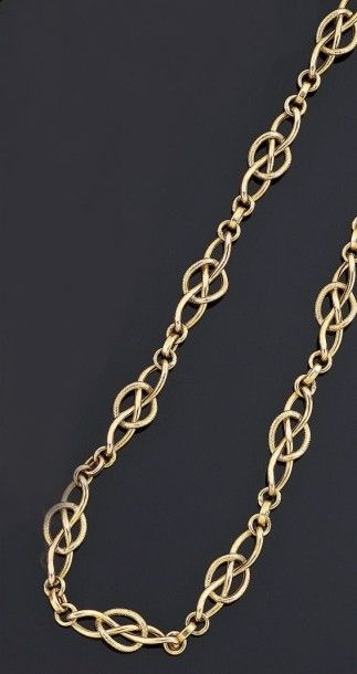 COLLIER articulé en or jaune 18 k 750°/oo...