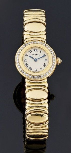 CARTIER
Montre bracelet de dame en or jaune...