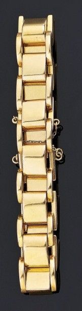 BRACELET articulé en or jaune 18 k (750°/oo)...