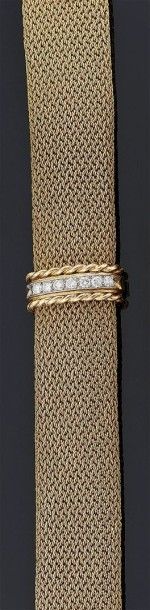 LARGE BRACELET souple en or jaune 18 k 750°/oo...