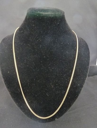 COLLIER articulé en or jaune 18 k 750°/oo....