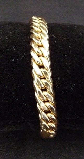 BRACELET articulé en or jaune 18 k 750°/oo,...