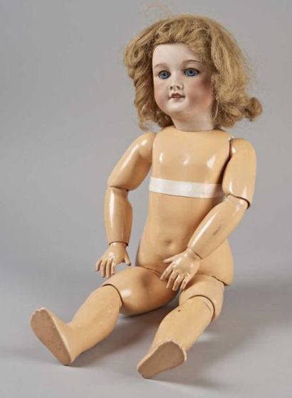 POUPEE - Tête en porcelaine portant une inscription...