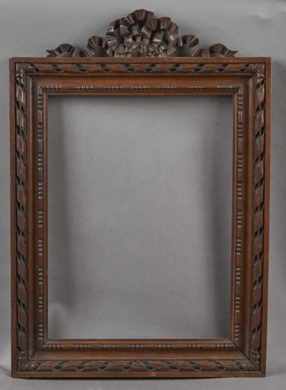 CADRE en bois naturel sculpté à décor de...