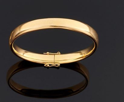 BRACELET rigide ouvrant en or jaune 750°/oo...