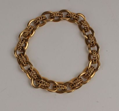 BRACELET articulé en or jaune 750°/oo les...