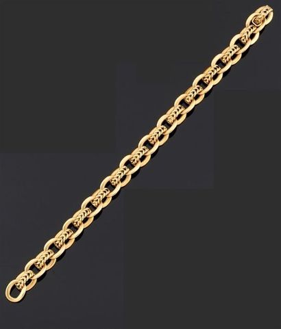 BRACELET articulé en or jaune 750°/oo les...