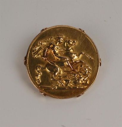 BROCHE ronde en or jaune 750°/oo gravé au...