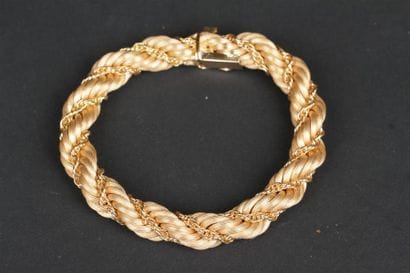 BRACELET souple en or jaune 750°/oo partiellement...