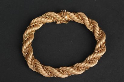 BRACELET souple en or jaune 750°/oo partiellement...