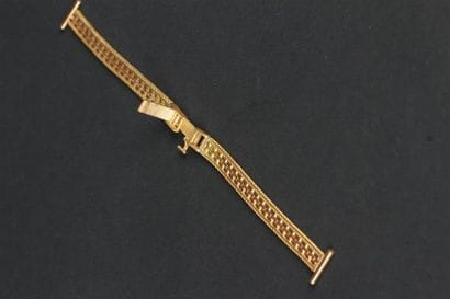 BRACELET de montre souple en or jaune 750°/oo...
