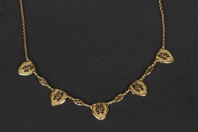 COLLIER articulé en or jaune 750°/oo retenant...