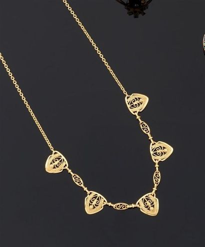 COLLIER articulé en or jaune 750°/oo retenant...