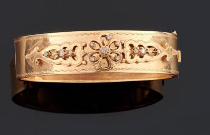 BRACELET rigide ouvrant en or jaune 750°/oo...