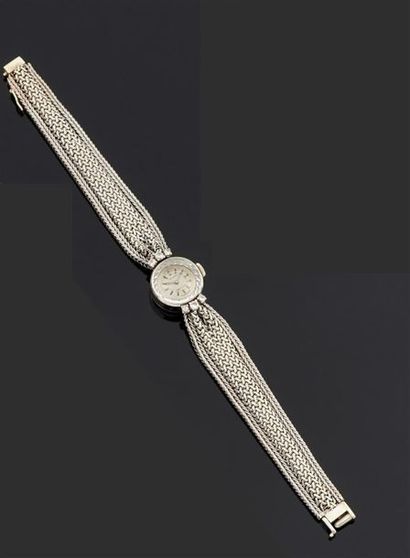 MOVADO.
Montre bracelet de dame en or gris...