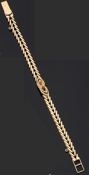BRACELET articulé en or jaune 750°/oo, les...