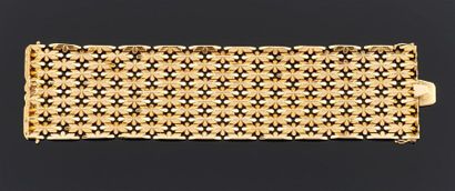 BRACELET large et articulé en or jaune 750°/oo,...
