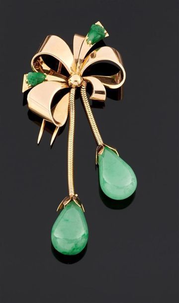BROCHE noeud en or jaune 750°/oo ornée de...