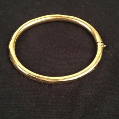 BRACELET rigide ouvrant en or jaune 750°/oo...