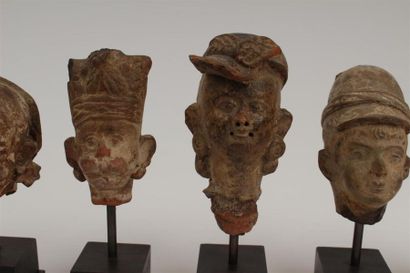 SIX TETES en pierre sculptée et terre cuite...